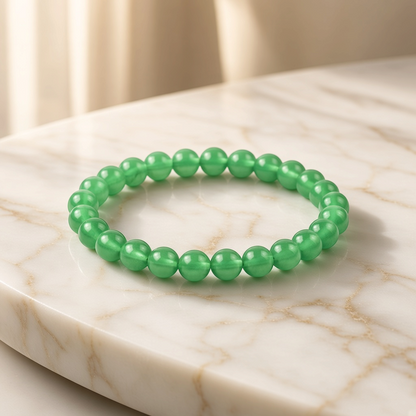 Shri Divya Ratan natural green aventurine crystal bead bracelet on a white marble surface