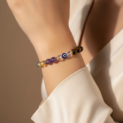 Shri Divya Ratan Nazar protection bracelet featuring 8mm multi-colored crystal beads and an evil eye charm on a wrist